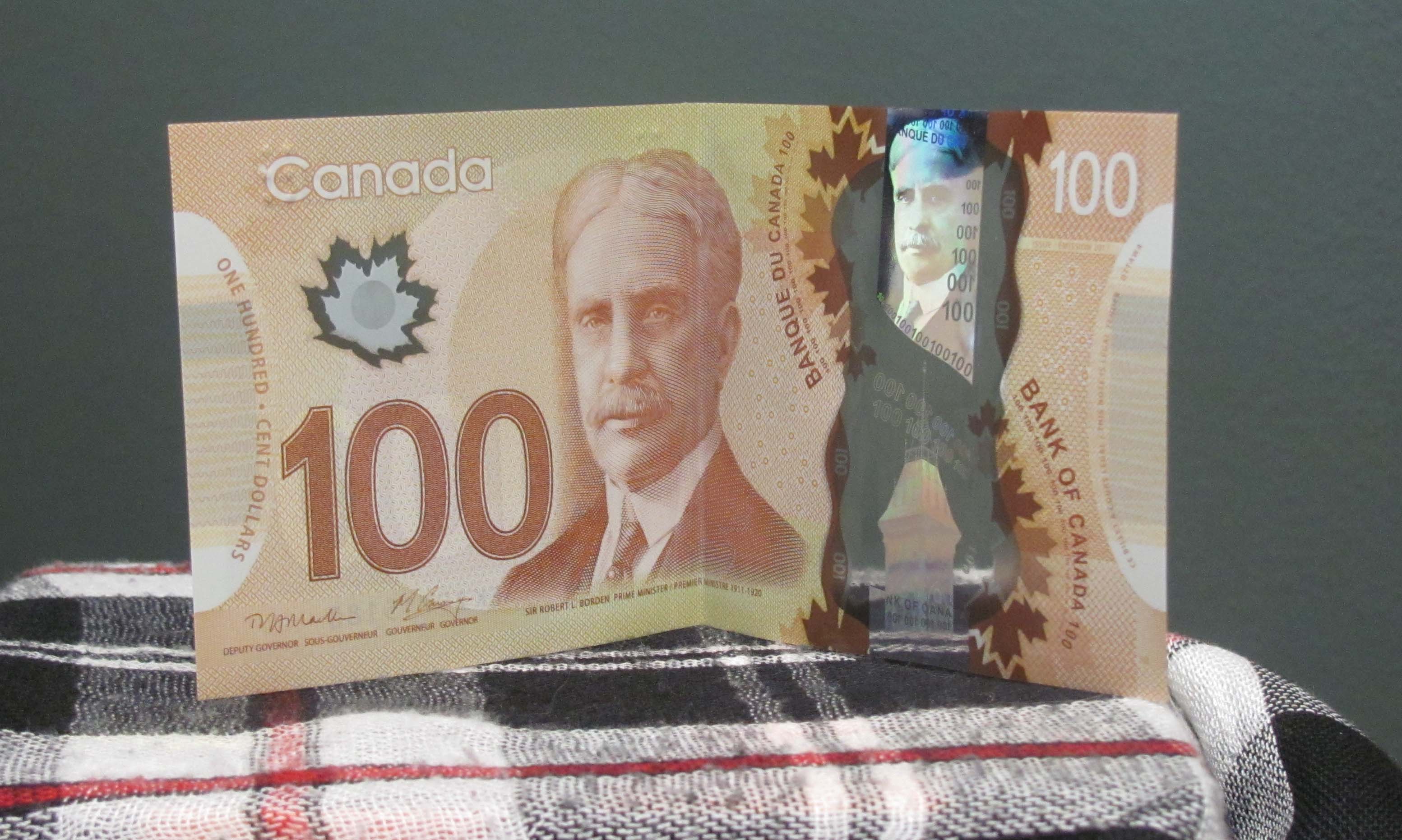 money-nw-new-canadian-100-dollar-bills-nov-14-2011-2.jpg